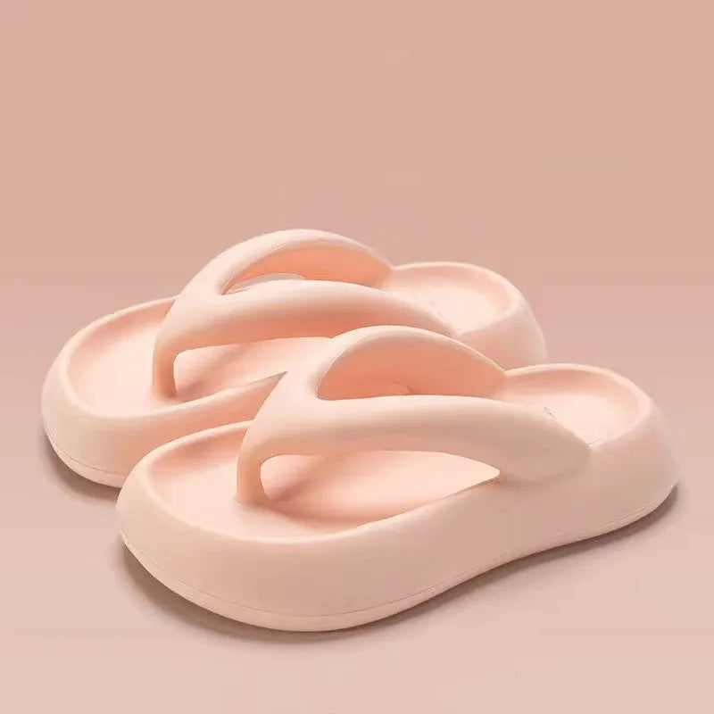 Solid colour women's flip-flops with a thick sole, decorative bow, and thong strap.