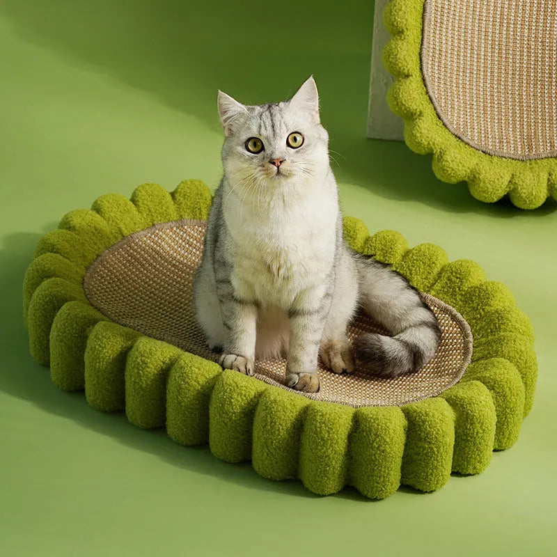 Green oval cat scratch pad and lounge bed made from sisal material