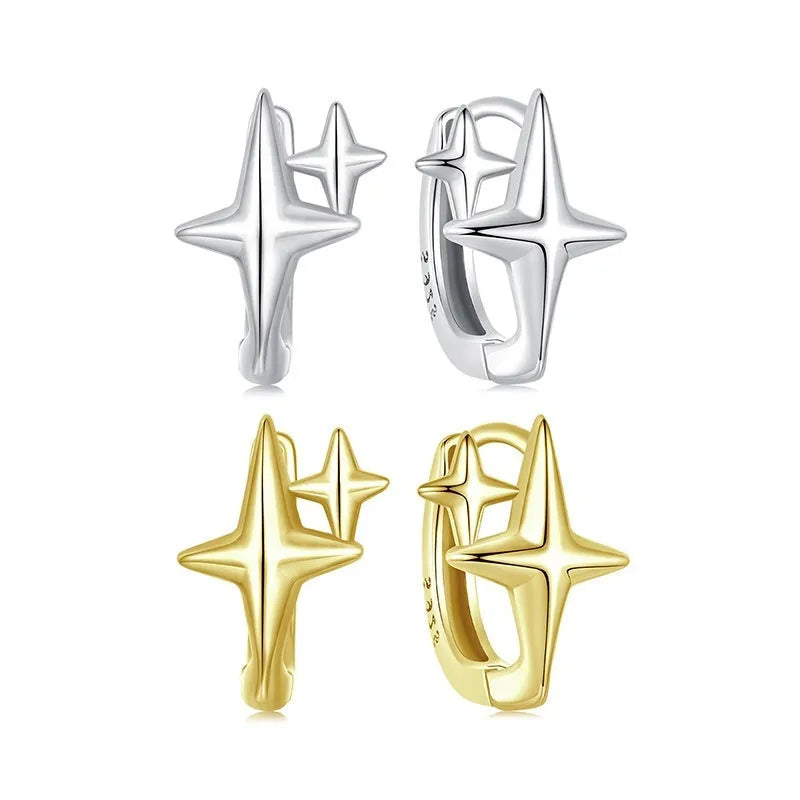 Minimalist oxidised sterling silver star clip-on earrings with XINGX detail on a white background.