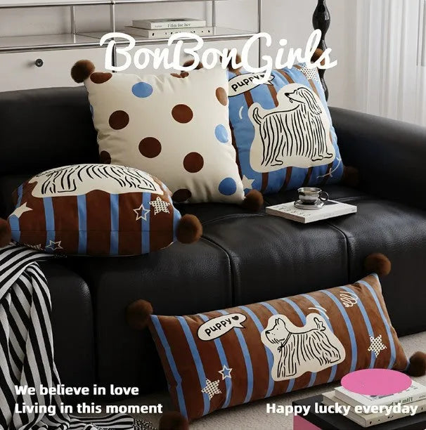 Blue cartoon animal print cushion and matching pillowcase on a sofa
