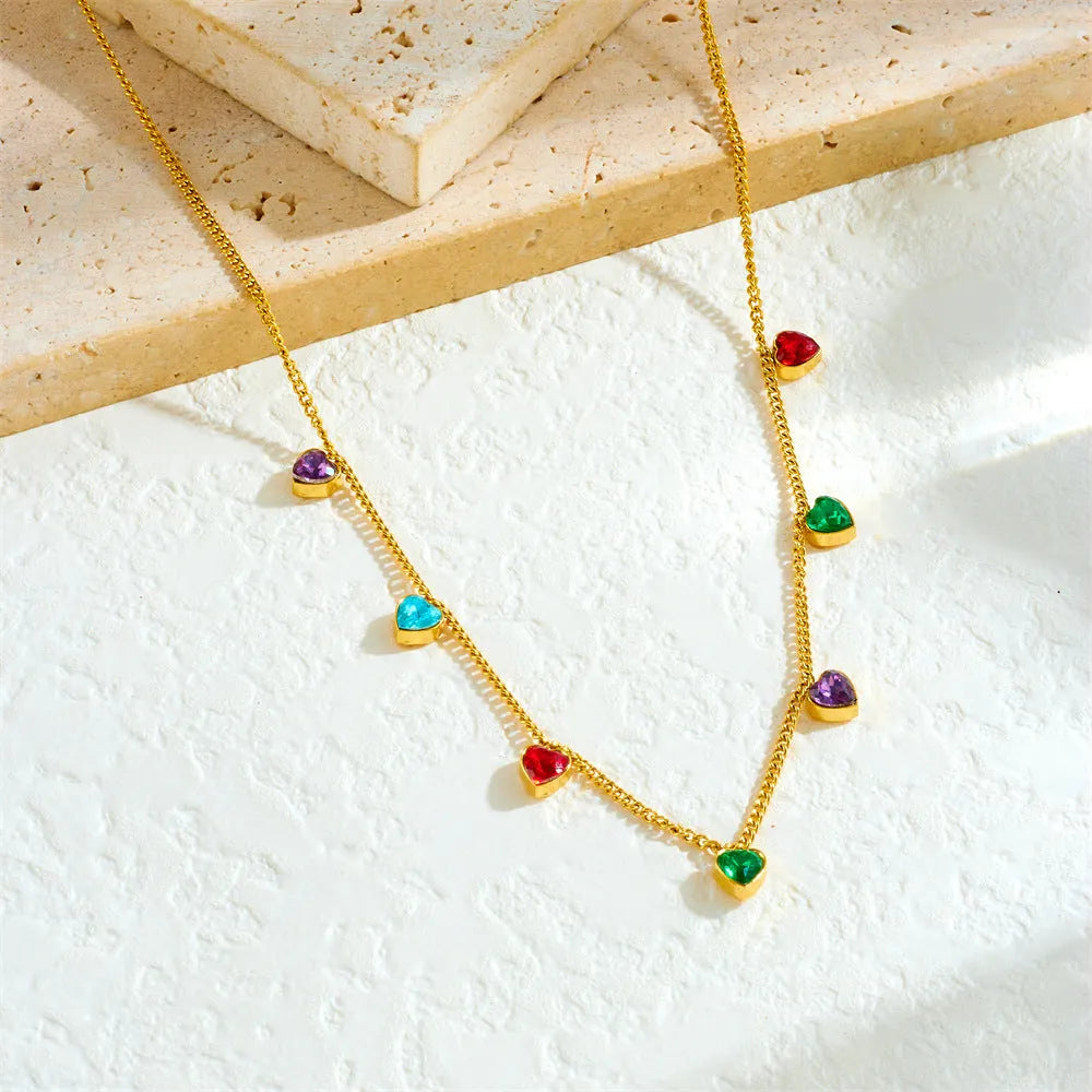 Gold-plated stainless steel necklace with a heart pendant on an adjustable chain.