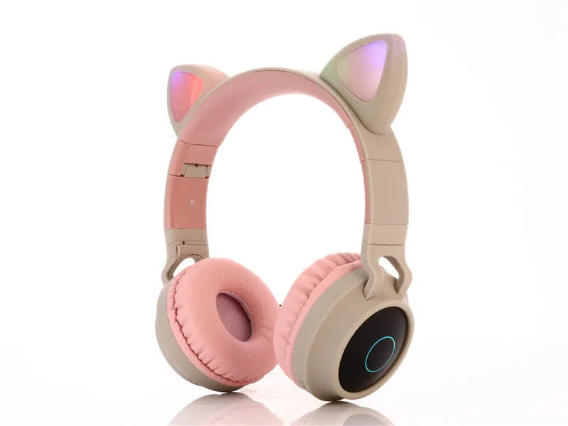 Cartoon-style wireless Bluetooth headset with cat ears, shown in a choice of five colours including green and pink.