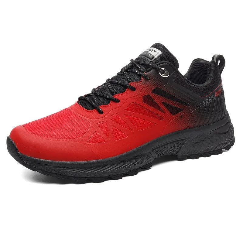 Men's plus size black and orange breathable mesh running shoes with lace-up front and rubber sole.