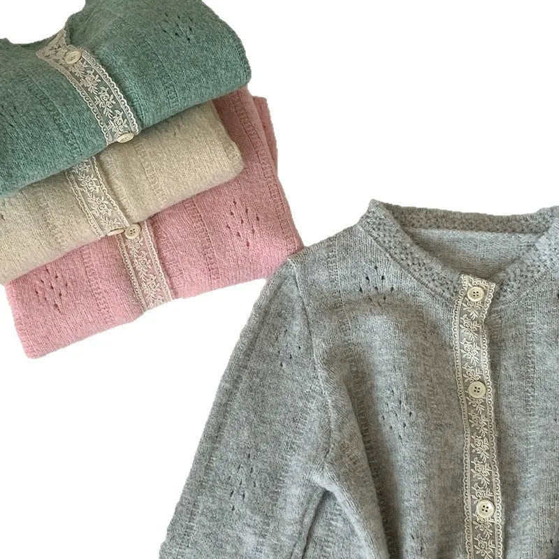 Loose apricot-coloured retro-style knit cardigan coat on a hanger