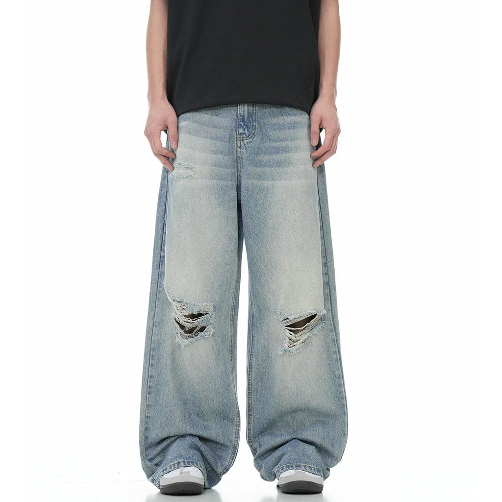 Men's blue straight-leg ripped jeans with zipper fly and retro styling in cotton blend fabric
