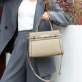 Small square genuine leather shoulder bag in almond green with sandwich pocket exterior