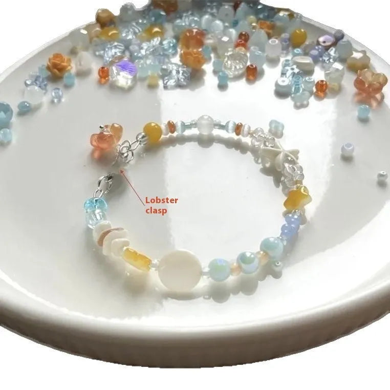 Orange sea coloured mixed material summer bracelet with diamond shape and round elements