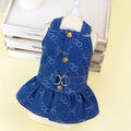 Small dog wearing denim princess dress with bracket skirt styling in blue denim fabric