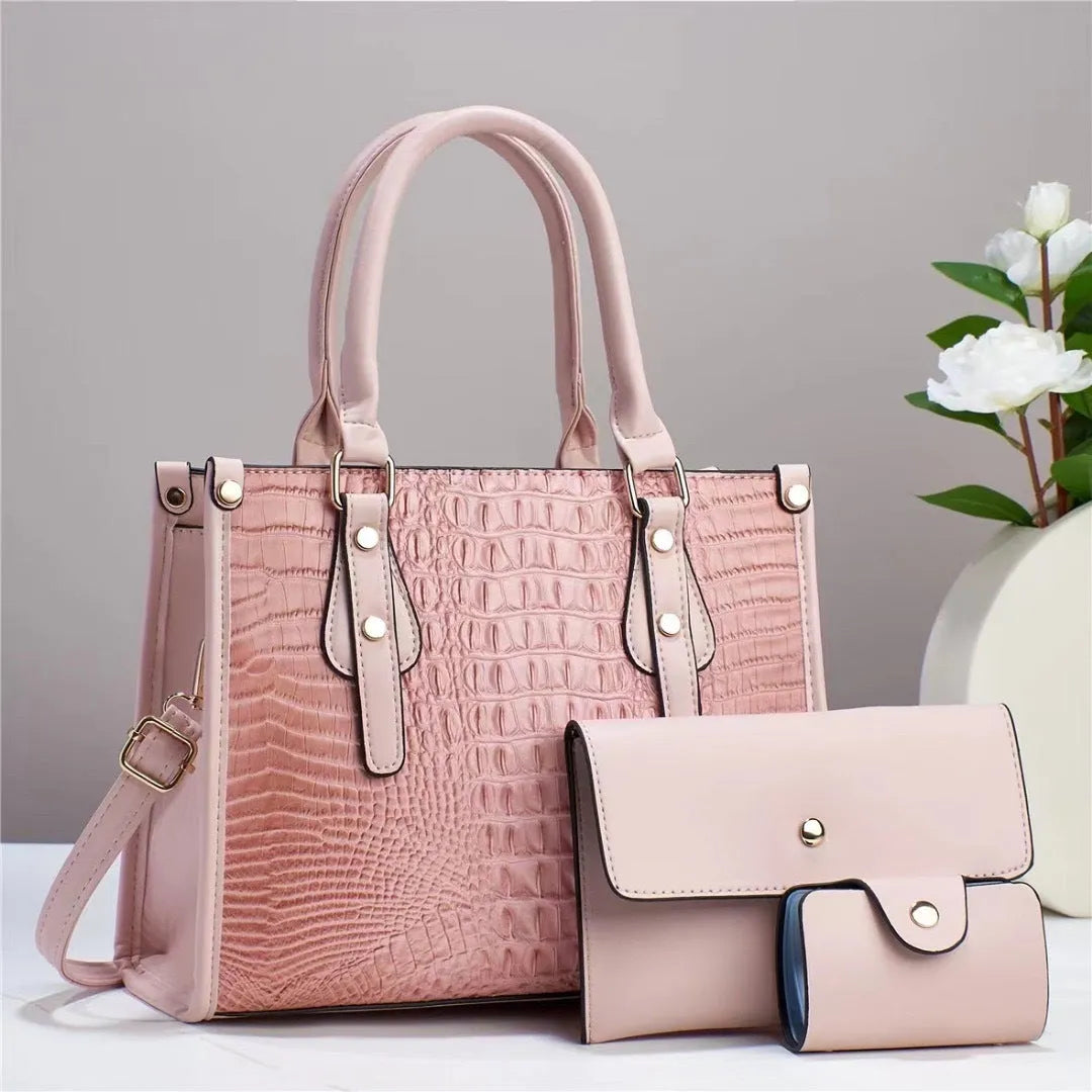 Women's burgundy PU leather bucket crossbody bag set with matching wallet and card holder.