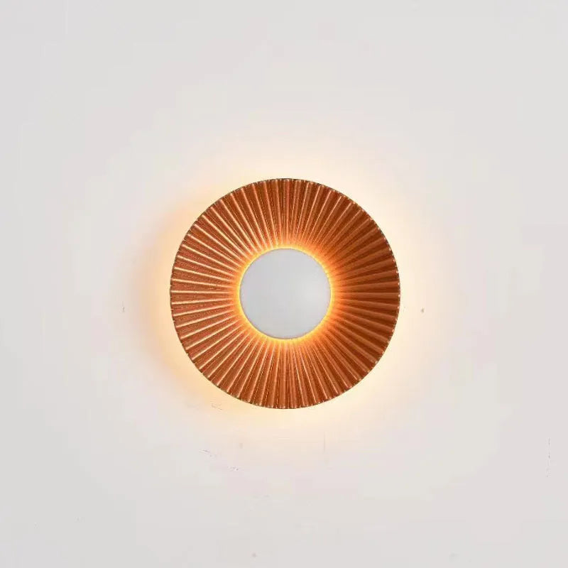 Round aluminium wall lamp with LED light in a choice of colour finishes including white and gold.