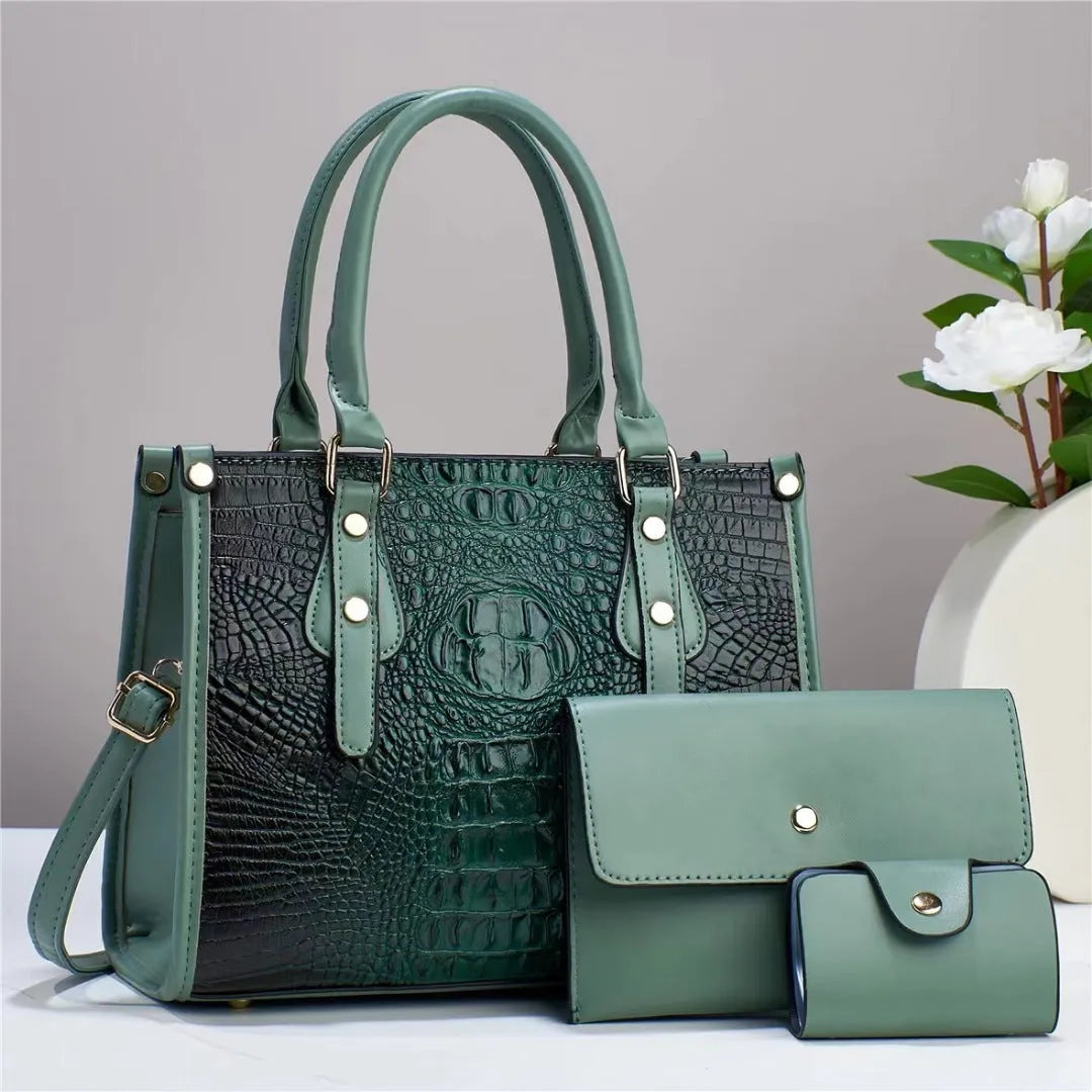 Women's burgundy PU leather bucket crossbody bag set with matching wallet and card holder.