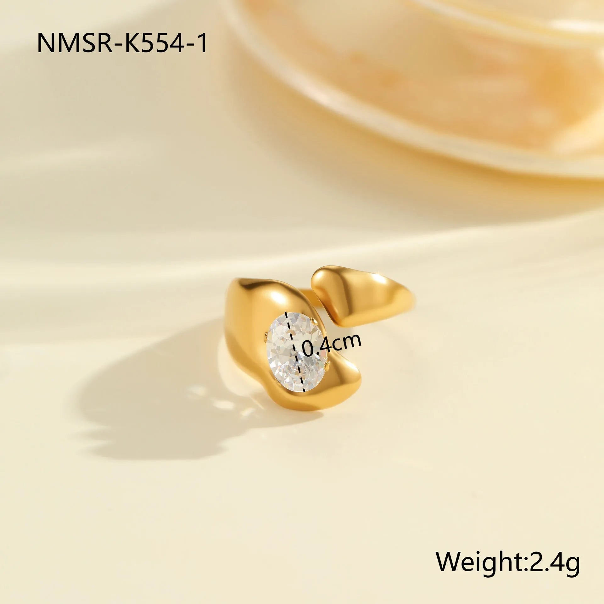 Women's geometric zircon ring with adjustable open mouth design on a hand.