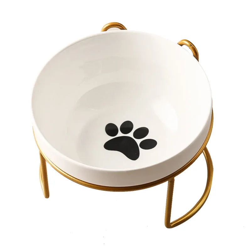 White ceramic cat bowl with cat paw print pattern in a black iron cat-ear frame