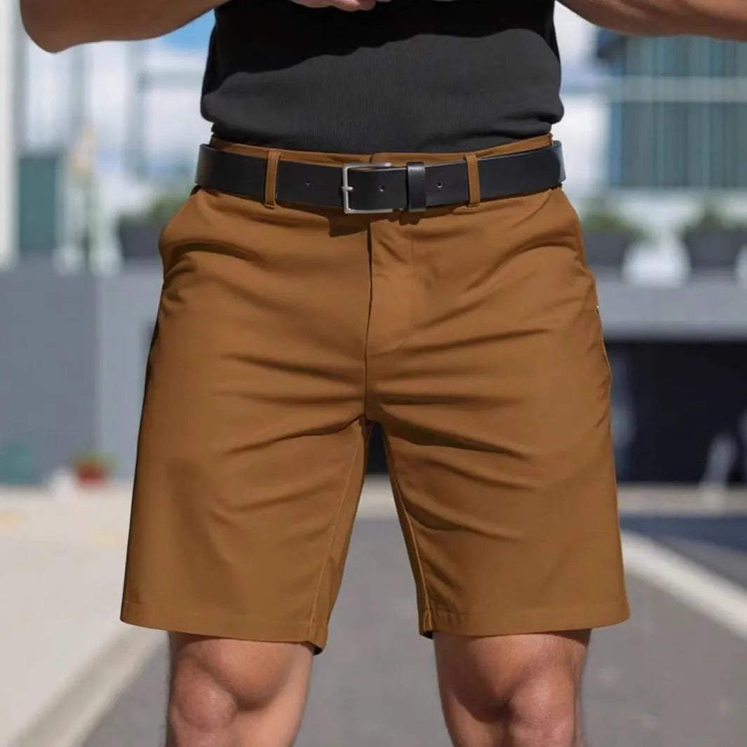 Men's solid colour straight-leg polyester shorts with micro elasticity, shown in apricot.