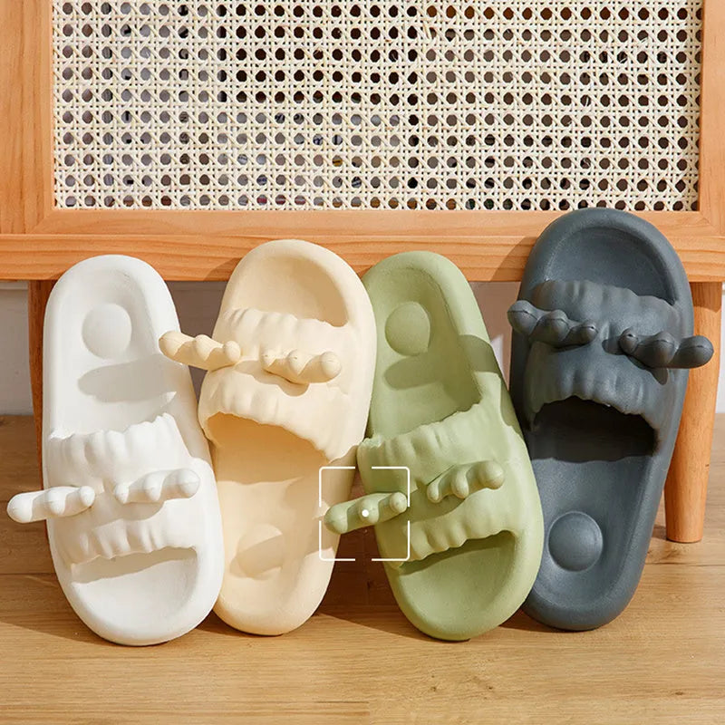 White women's flip flop slippers with deer horn design and hollow-out EVA upper on a light background.
