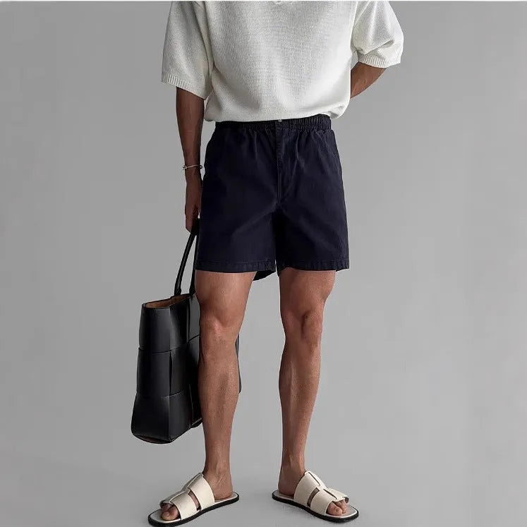 Cotton sports shorts in loose fitting design available in black, white and khaki colours