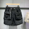Men's black loose-fit cargo work shorts on a mannequin, showing multiple pockets and above-knee length.