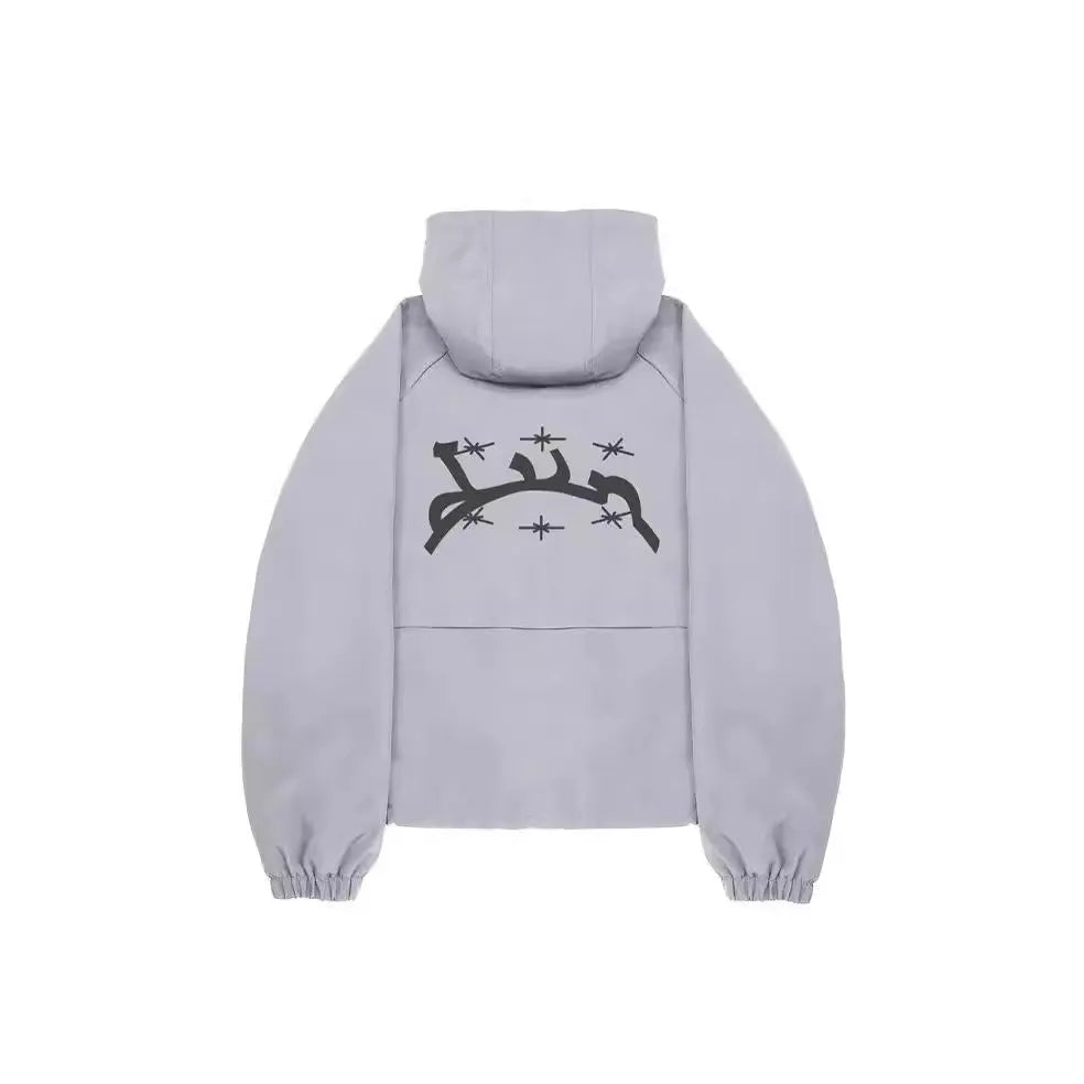 Grey loose-fit men's hooded sunscreen jacket in British style hanging on a hanger.