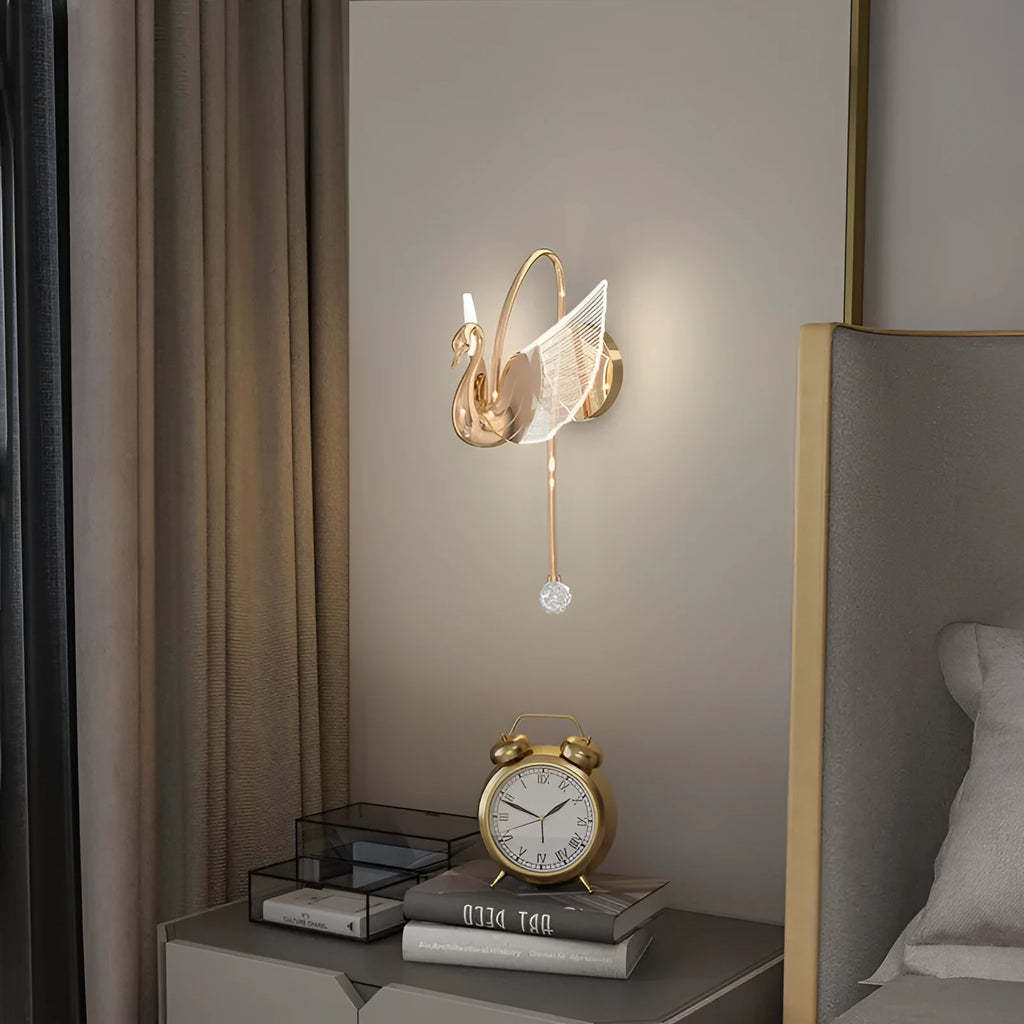 Gold swan design wall lamp with acrylic shade showing LED lighting and iron construction