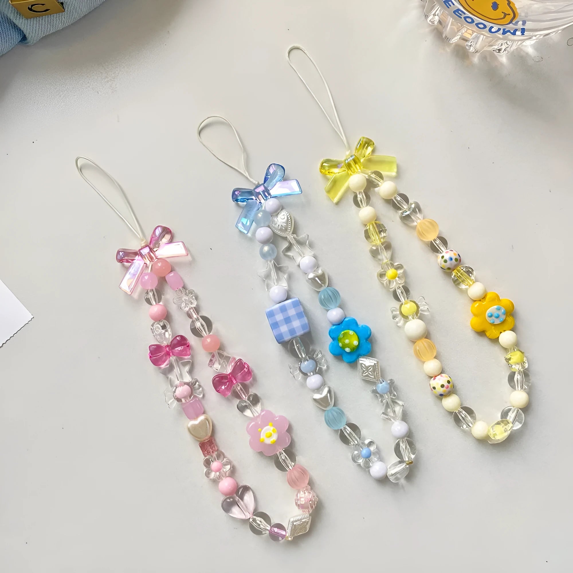 Colourful beaded flower mobile phone lanyard with detachable metal lobster clasp in blue, pink, or yellow designs