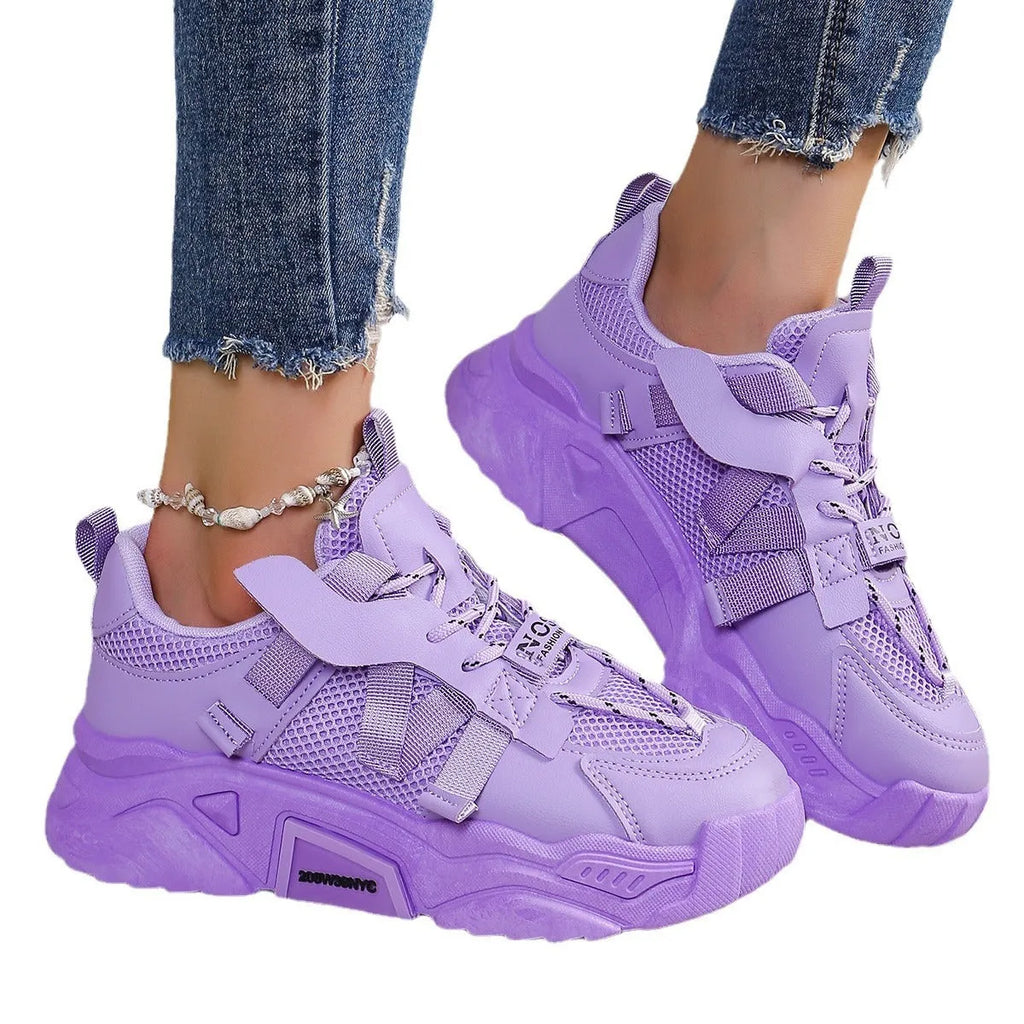 Women's purple platform mesh dad shoes with animal pattern and lace-up front.