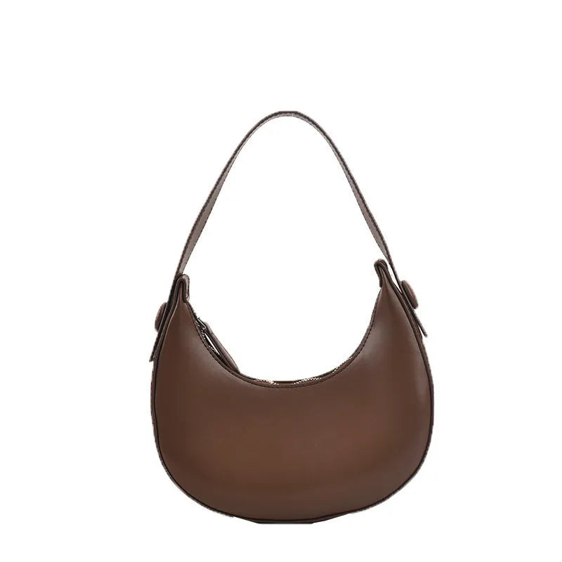Women's retro brown dumpling-shaped PU shoulder bag showing front pocket and crossbody strap.
