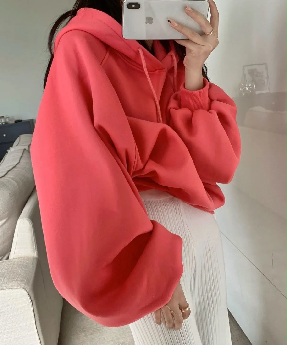 Watermelon red women's sleeveless Mulberry Silk hoodie on a hanger.