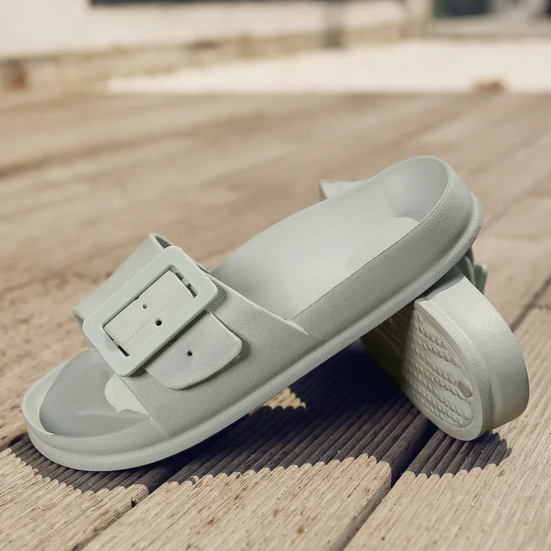 Women's grey blue flip-flop slippers with a single buckle and soft EVA sole.