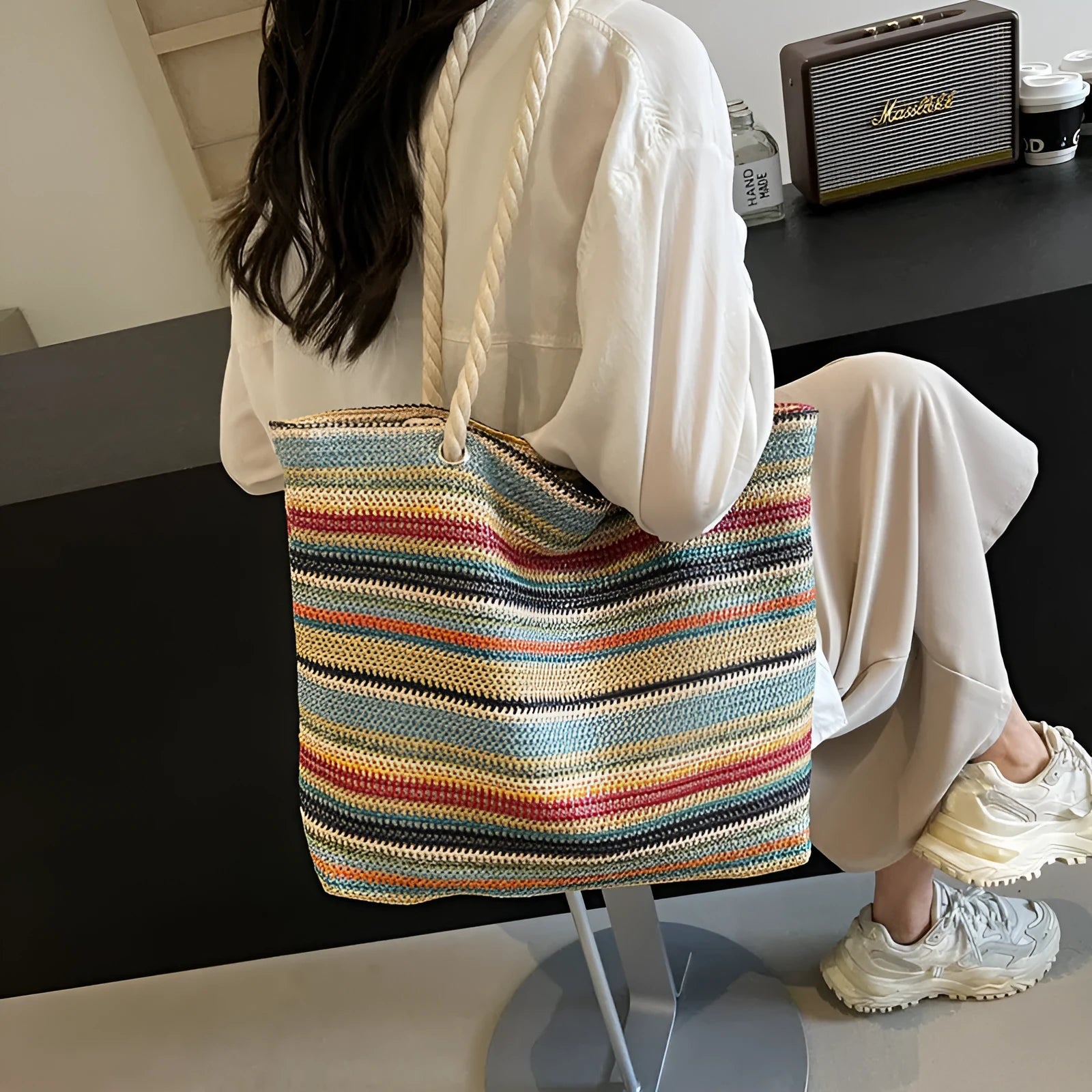 Blue straw woven nylon shoulder bag with single strap and woven texture pattern