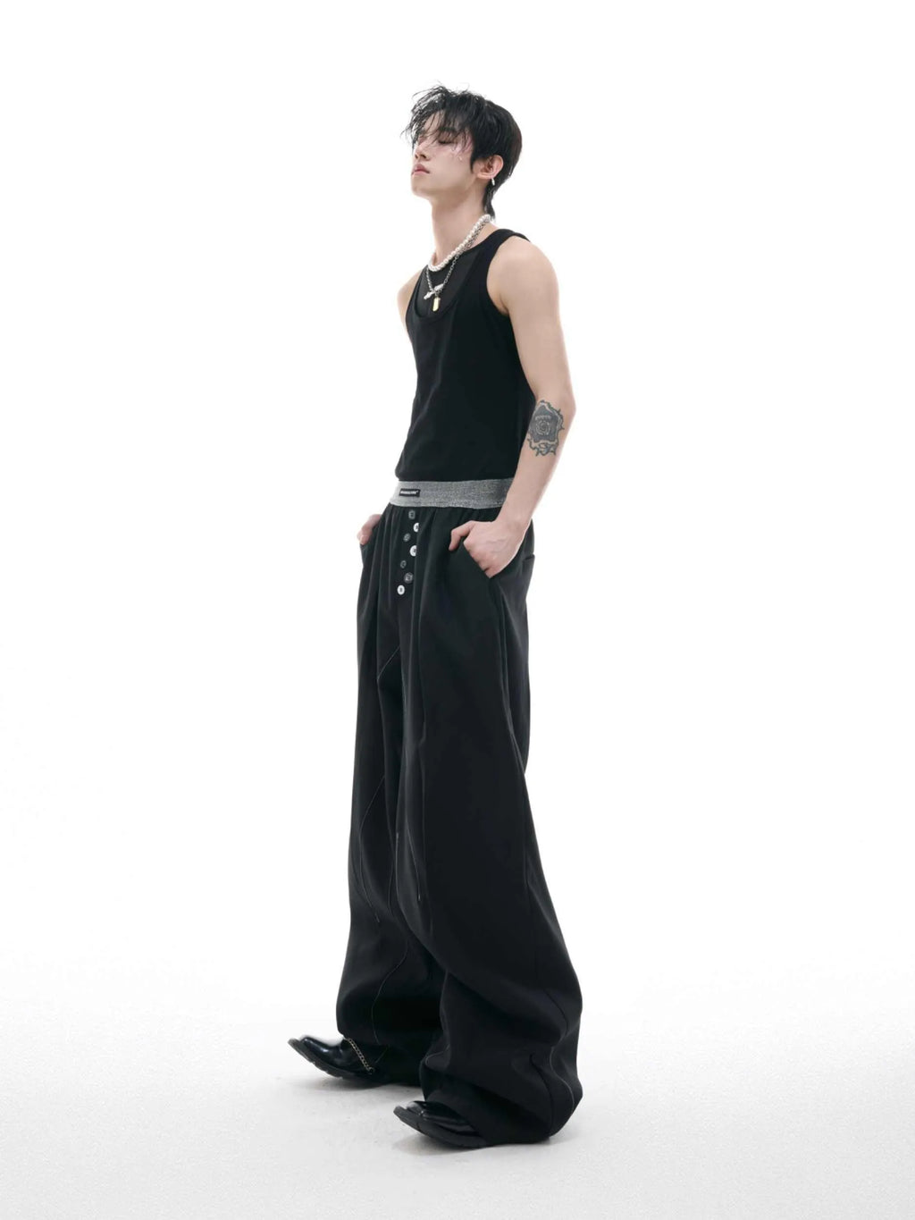 Straight-leg high-waist trousers with button open line detailing in black and grey colours