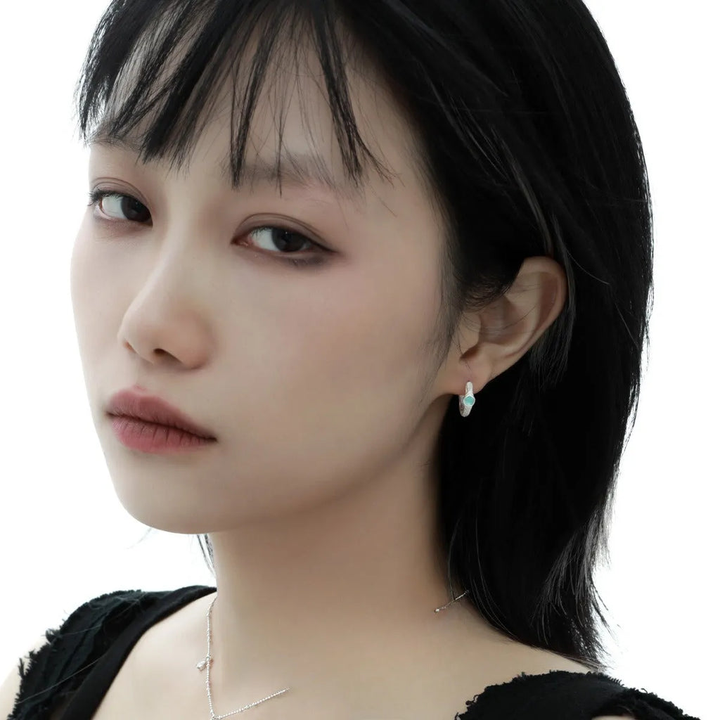 Geometric women's ear clip in burnt silver electroplated 925 silver with round design element