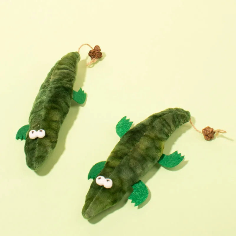 Green plush alligator catnip toy with plant-based materials and natural peppermint scent