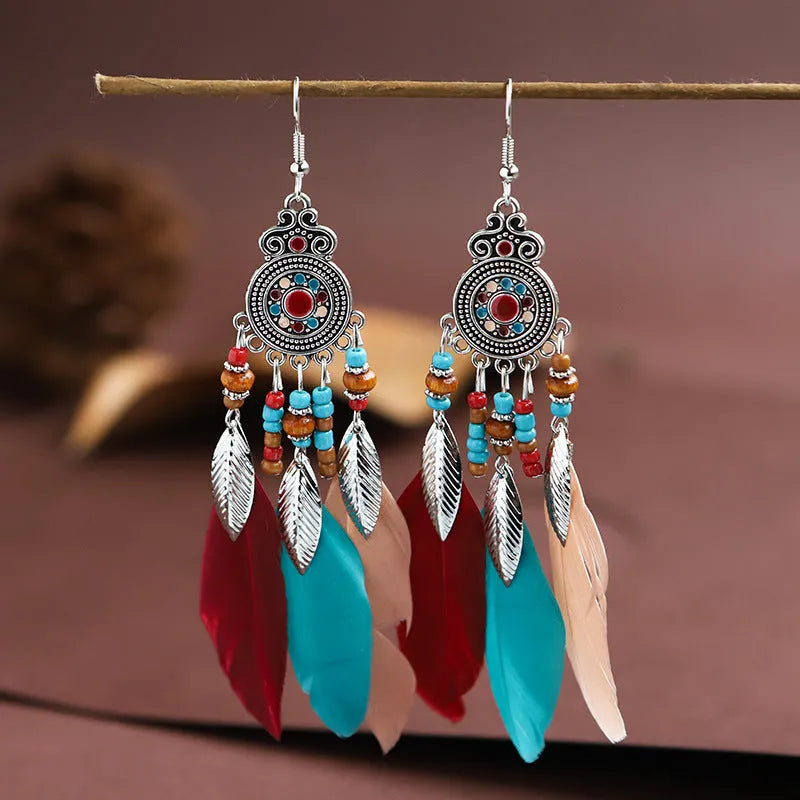 Feather pattern drop earrings with round oil craft design in alloy with electroplated finish