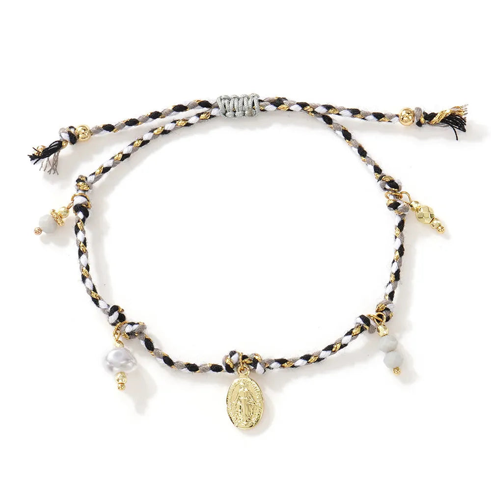 A colourful hand-woven braided rope bracelet with an adjustable strap and tag charm.