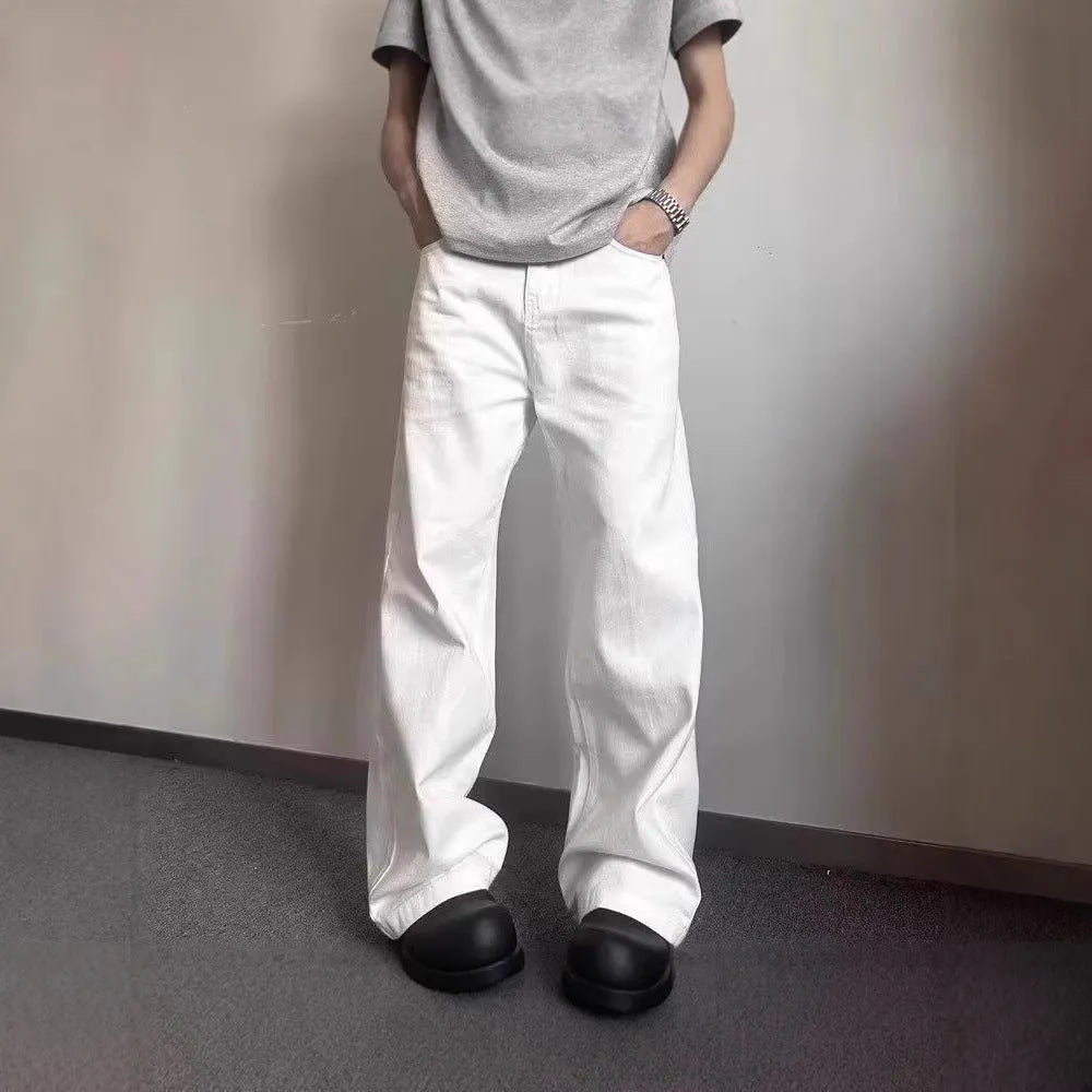 Men's white straight-leg denim jeans with loose wide-leg cut and mid-waist design