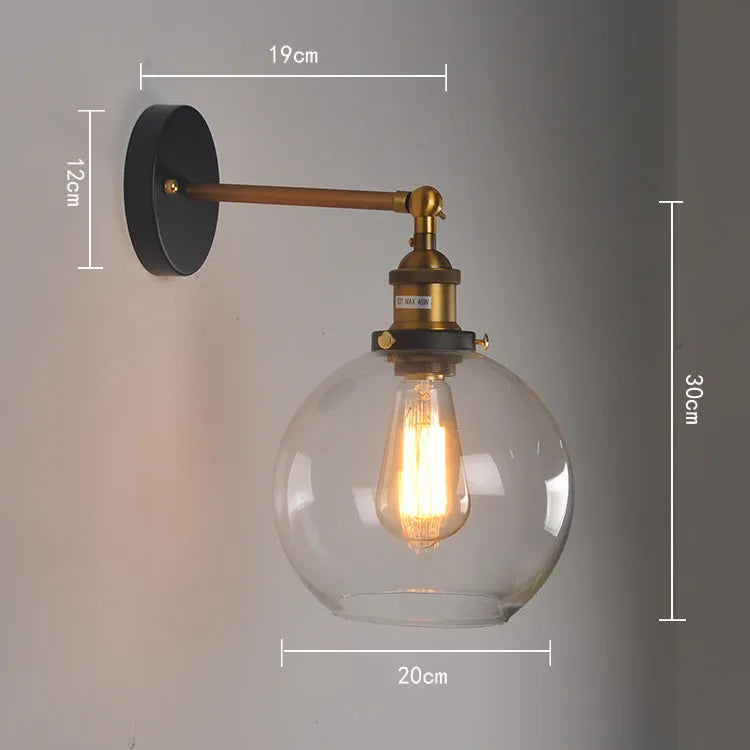 Retro round glass ball wall lamp in amber finish with 20cm diameter and aluminium holder.