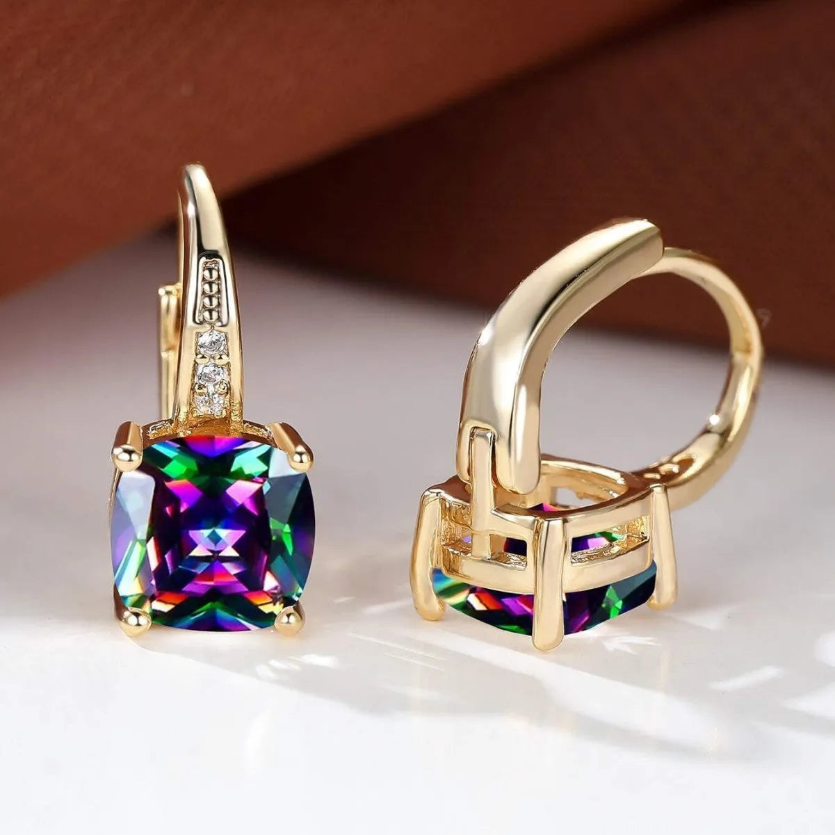 Geometric square copper ear clip earrings with moissanite inlays in a gold electroplated finish.
