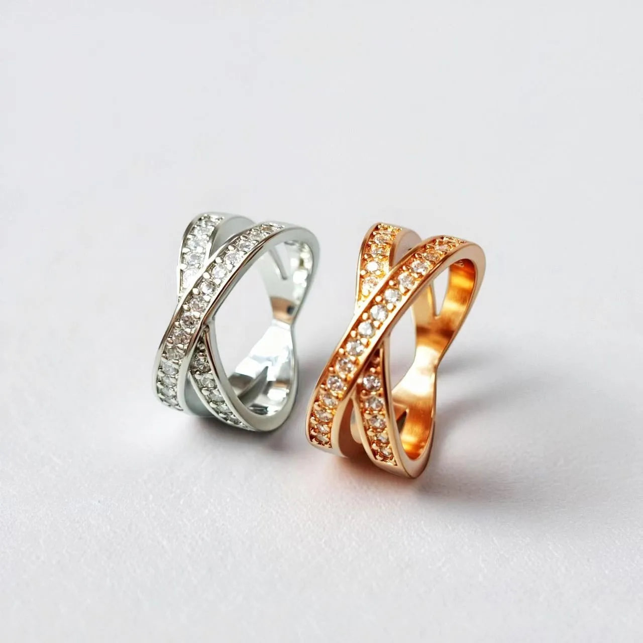 Silver or rose gold metal ring featuring a cross design with micro-inlaid zircon stones.