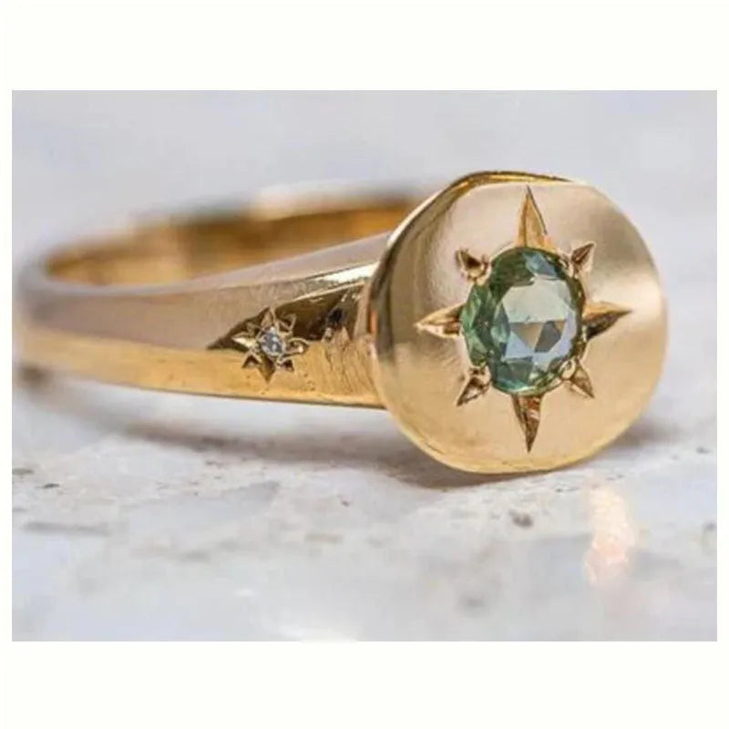 Golden star-shaped ring with oval zircon stone and adjustable opening