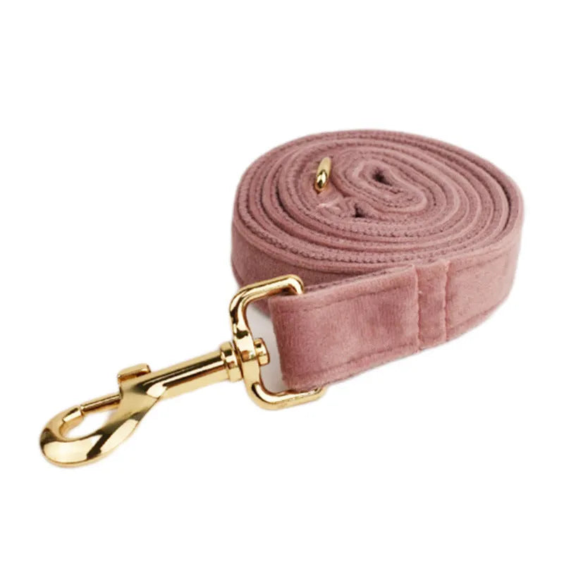 Light purple pink velvet dog collar set with leash, vest, bow, and poop bag accessories