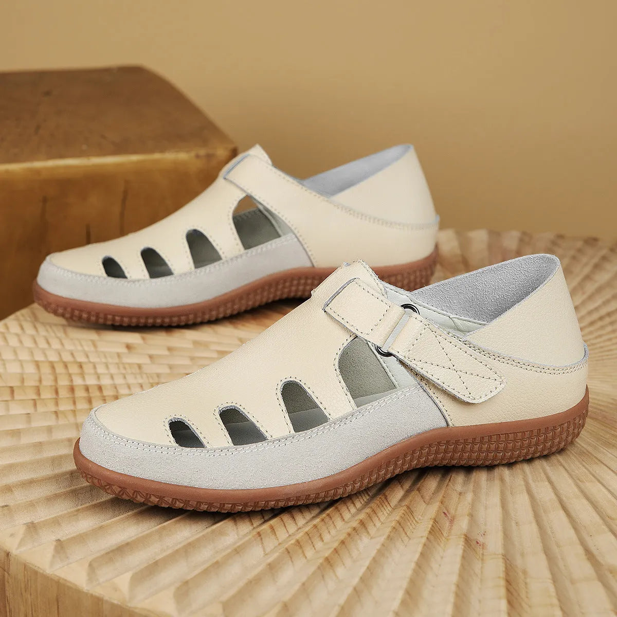 Women's plus size flat sandals in blue with hollow toe cap and breathable design on a thick rubber sole.