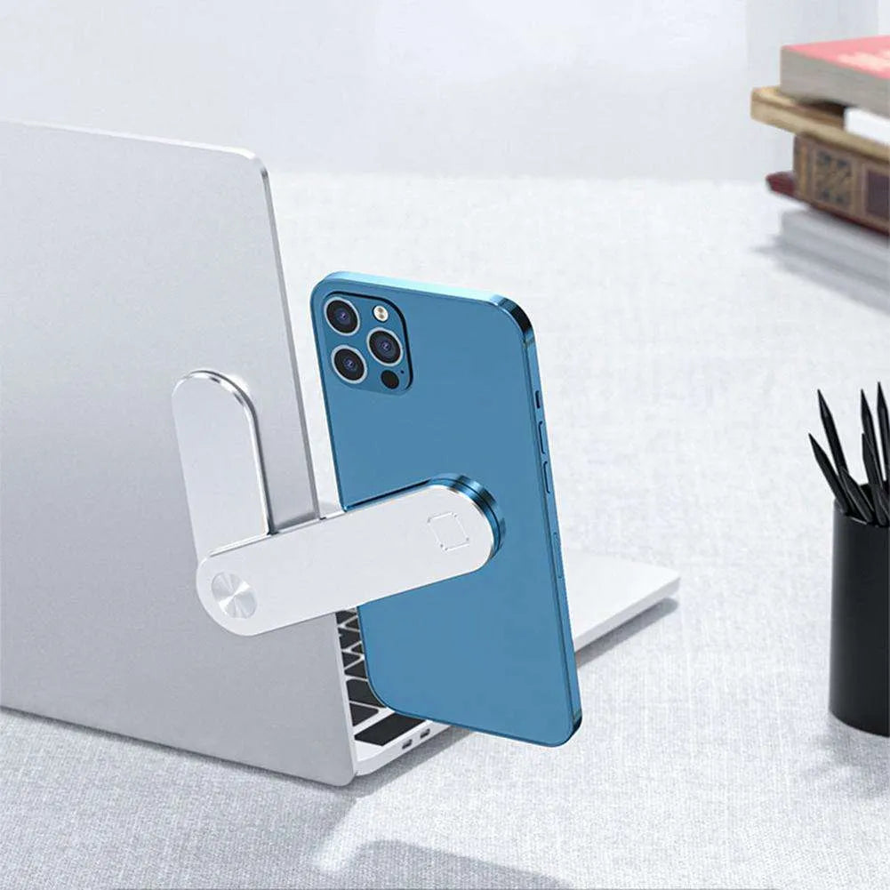 Black magnetic laptop phone holder with adjustable clip mounted on computer monitor