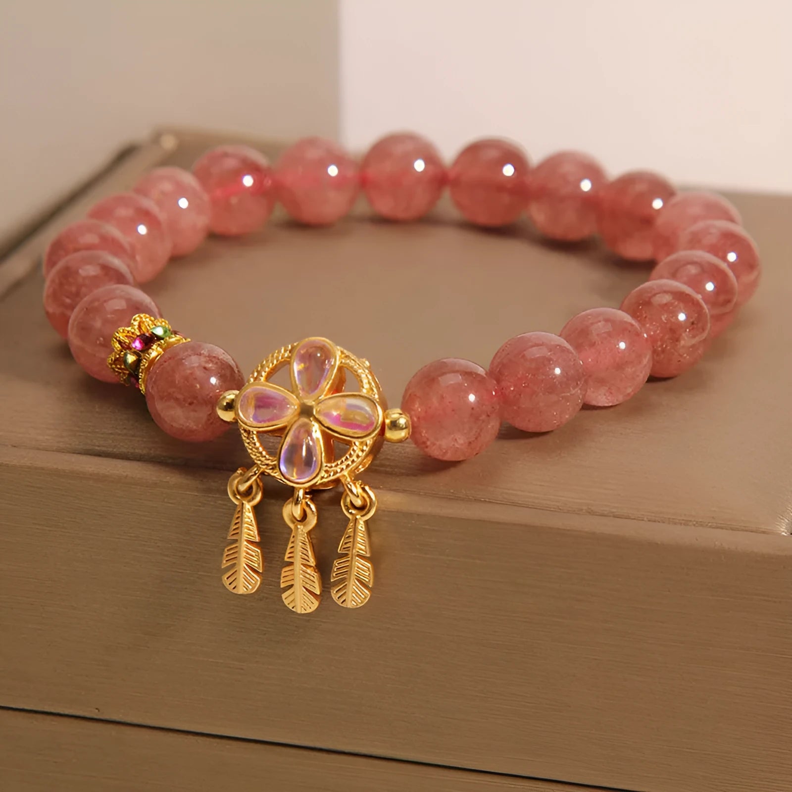 Women's strawberry quartz bracelet with four leaf clover dream catcher crystal pendant