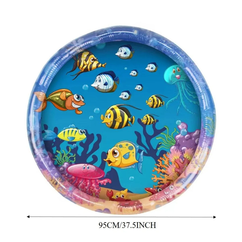Square blue water sensory playmat for cats on floor, showing ocean fish design and floating toys inside.