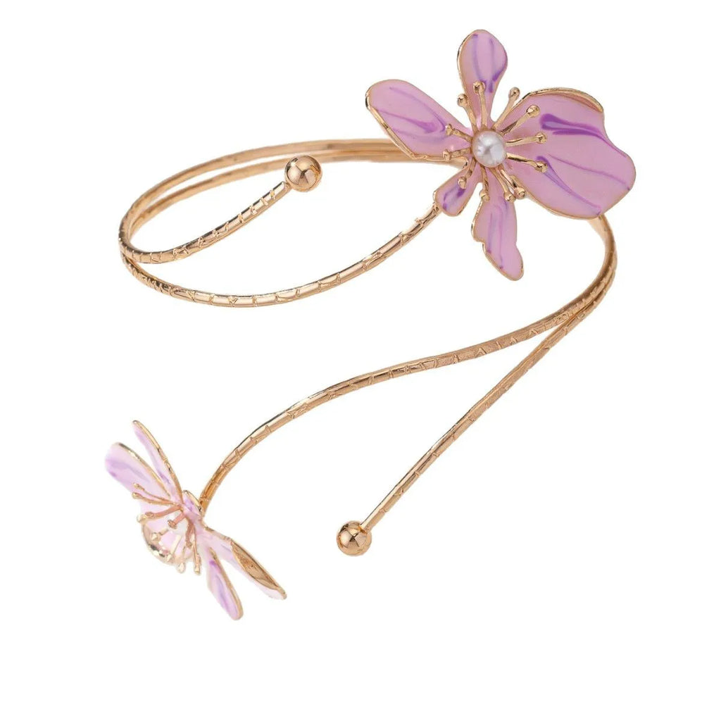 Pink alloy armband bracelet with hollow geometric linear pattern.