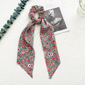 Spring dark green cloth hair tie with large intestine ring design and floral bandeau decoration
