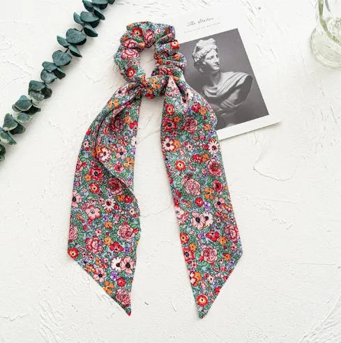 Spring dark green cloth hair tie with large intestine ring design and floral bandeau decoration