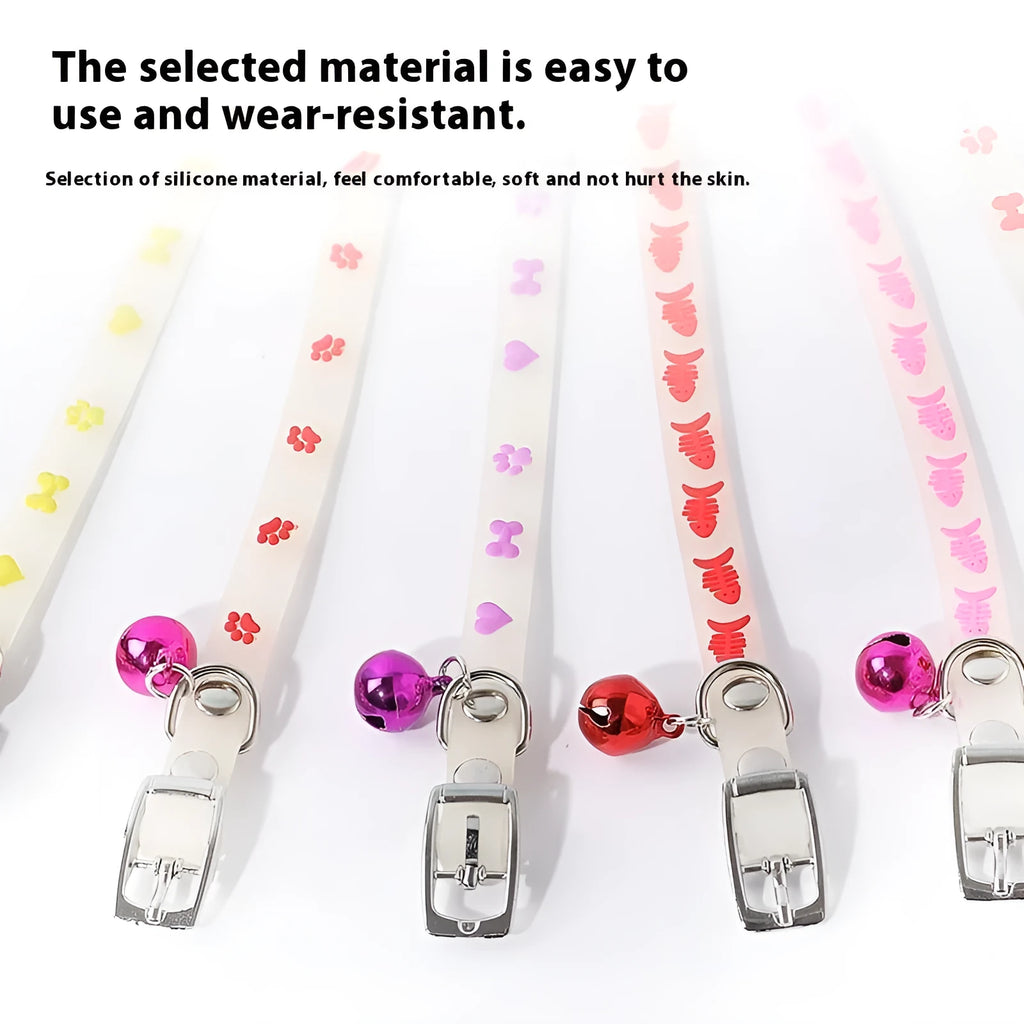 Glow in the dark cat collar with adjustable silicone chain and metal bell in paw print design