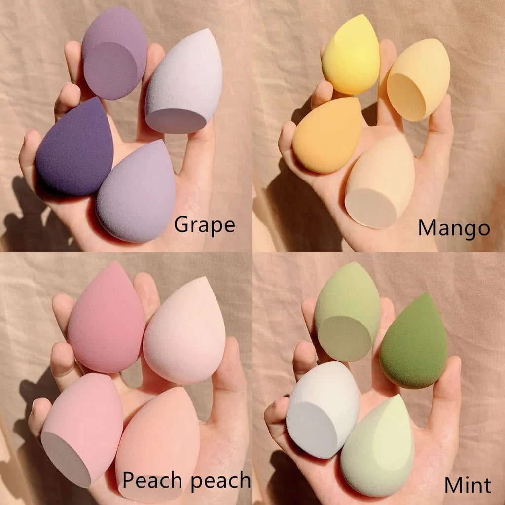 Four cosmetic sponge eggs in grape, mango, mint, and peach colours, each 6cm in size