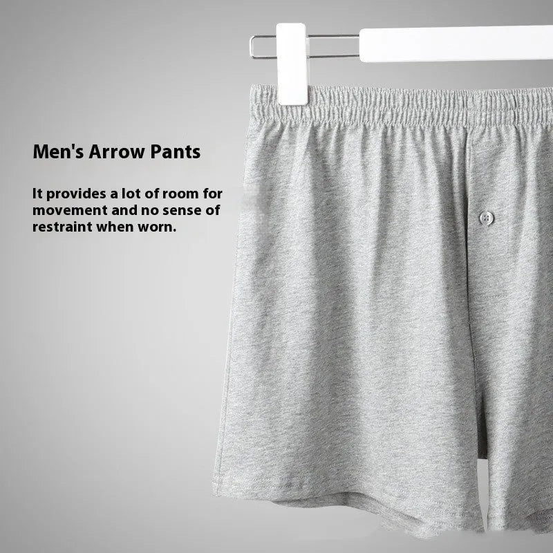 Men's solid-colour pure cotton boxer shorts with a high-waist and loose fit on a plain background.